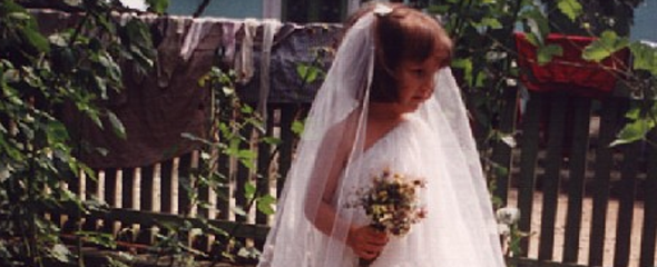 young girl dreesed up like a bride